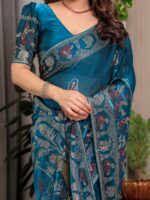 Peacock Teal Blue Fendi Satin Peacock & Floral Block and Foil Printed Saree with Traditional Border, Tassel Edges & Attached Blouse - Image 2